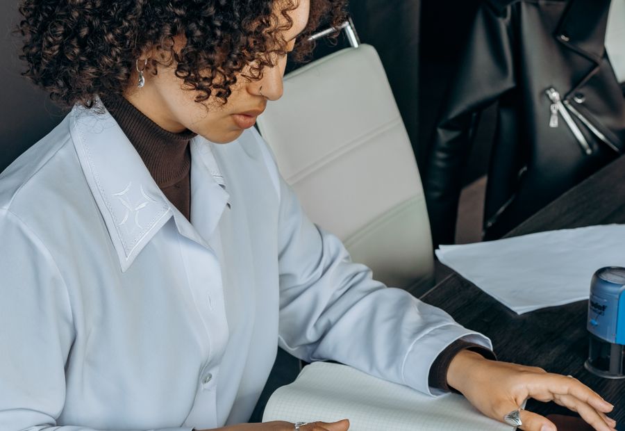 Finance team member working through figures at a desk