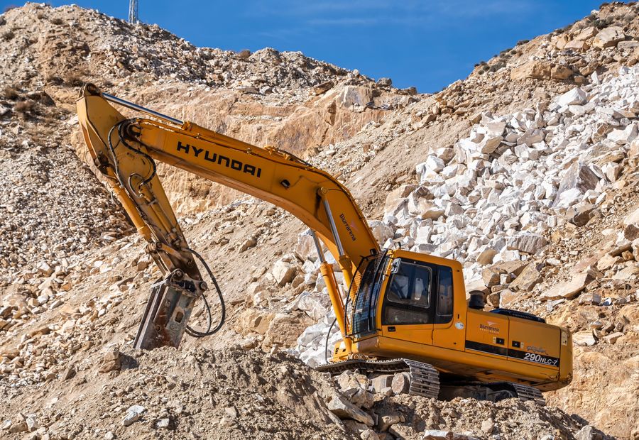 Tracked excavator working in a quarry